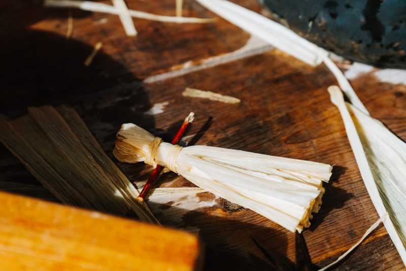 Corn husk doll on a table