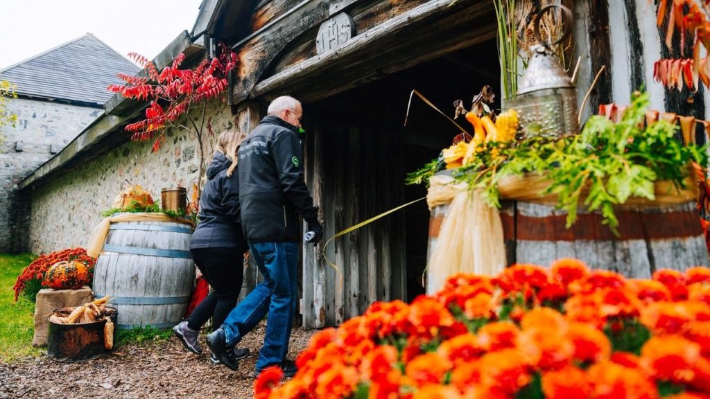 Two guest walking into Sainte-Marie, all decorated for the fall