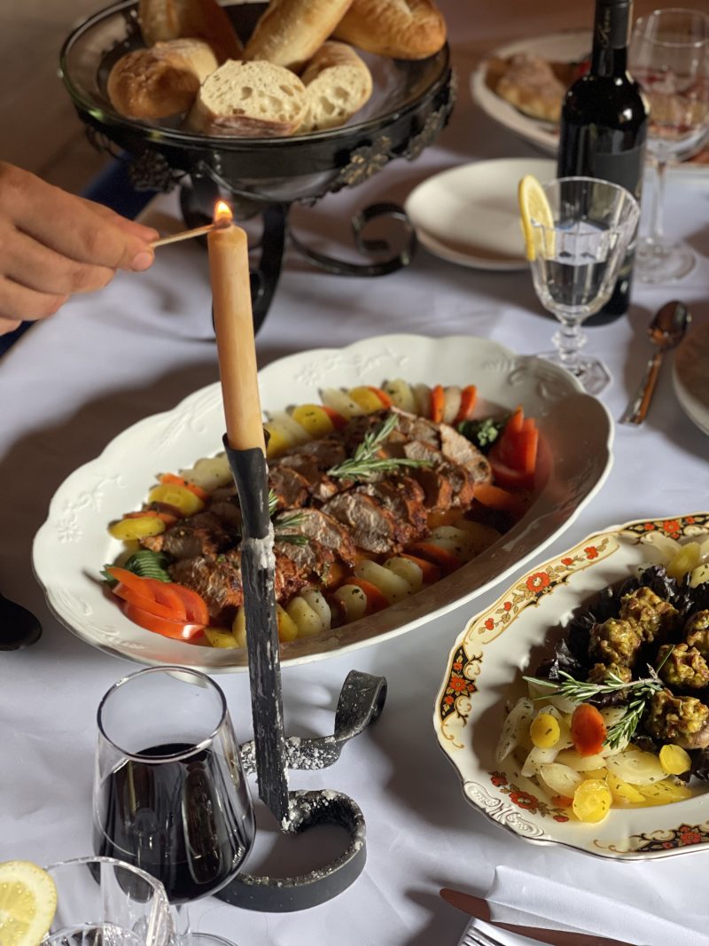 pumpkin sitting on historic dinning table inside of a historic building at Sainte-Marie