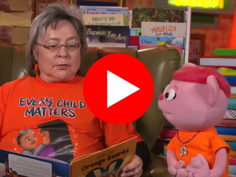Phyllis Webstadt and a muppet discuss Orange Shirt Day