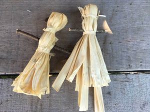 Two corn husk dolls