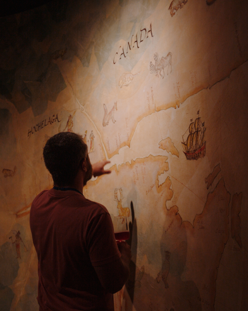 Guest looks at map on wall in museum